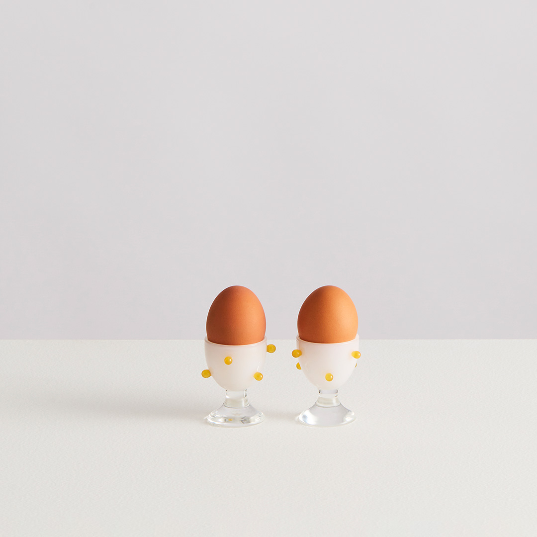 2 POMPONETTE EGG CUPS | clear white yellow